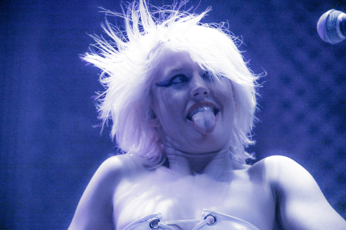 Amy Taylor of Amyl and The Sniffers with her tongue sticking out.