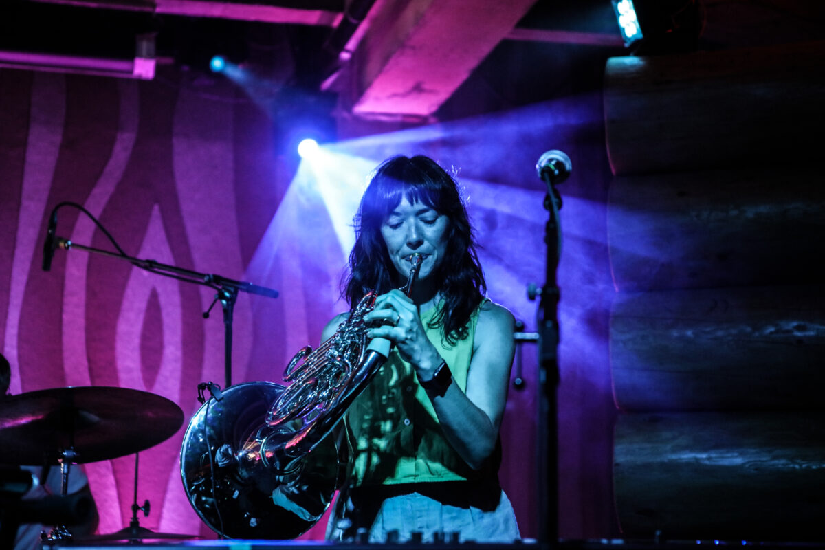 Sarah Perbix playing French horn at a Cloud Cult show in Portland